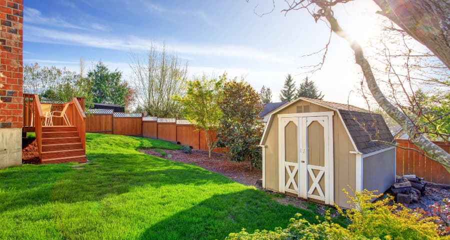 Fenced backyard with storage shed in New Brunswick